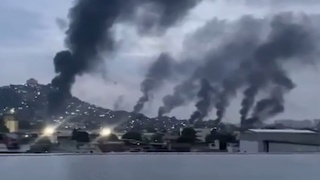 Горящий город из-за войны с наркомафией / Кадр из видео: Mash